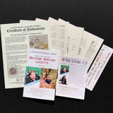 Extensive documentation package, including a "Certificate of Authenticity" from Cannon Beach Treasure Company, and "Treasure Hunters Gazette Volume 1," featuring images of explorers, arranged on a dark surface.