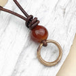 Bright Golden Bronze Celtic Ring Money with Carnelian Leather Necklace