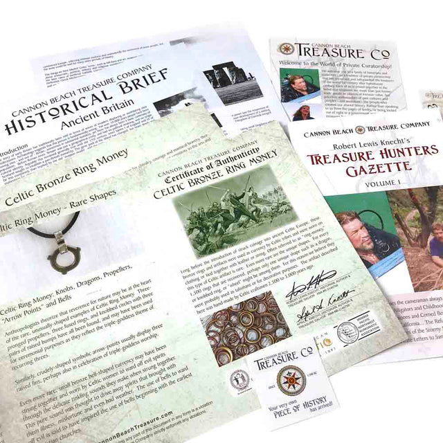 A collection of documents from Cannon Beach Treasure Company, including a "Historical Brief" on Ancient Britain, "Treasure Hunters Gazette," and "Certificate of Authenticity" for Celtic Bronze Ring Money, showcasing historical details.